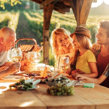 Family eating outside on a sunny deck